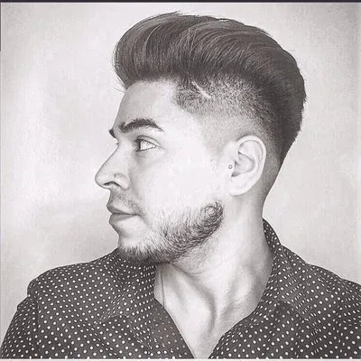 Men's textured cut with a clean fade by Holden Allen